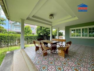 Outdoor patio with dining table and chairs