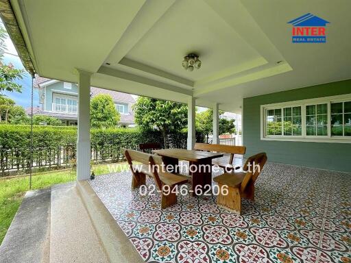 Outdoor patio with dining table and chairs