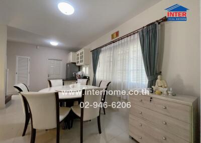 Dining room with table, chairs, and window view