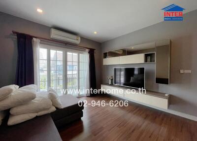 Living room with modern decor and wooden flooring