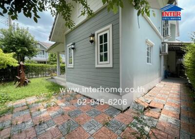 Side view of a house with garden area