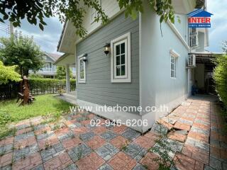 Side view of a house with garden area