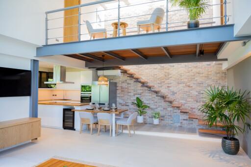 Modern living and dining area with open kitchen and mezzanine