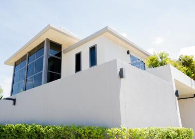 Modern two-story building exterior with large windows