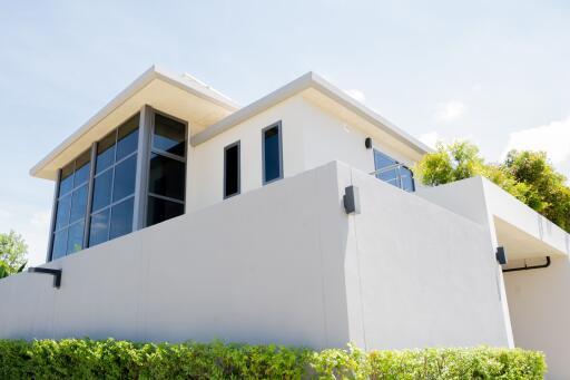 Modern two-story building exterior with large windows