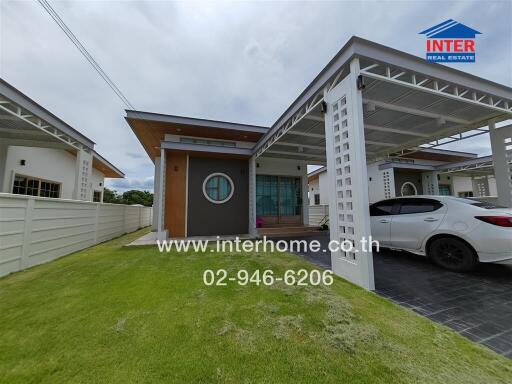 Modern single-story house with driveway and carport