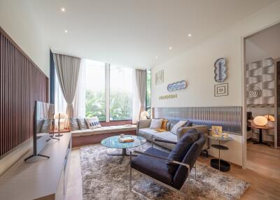 Modern living room with floor-to-ceiling windows and contemporary decor