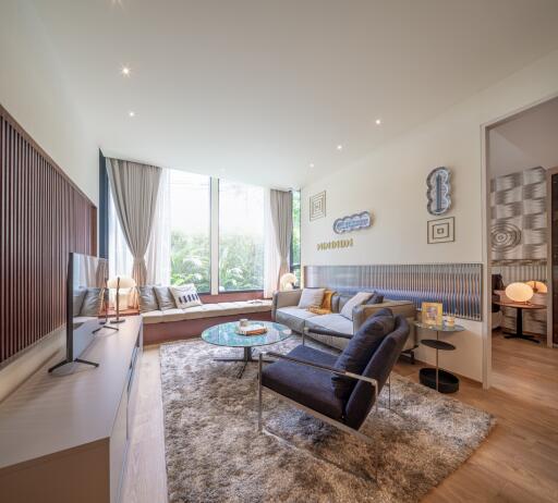 Modern living room with floor-to-ceiling windows and contemporary decor