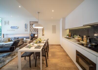 Modern open-plan dining and kitchen area with sleek design