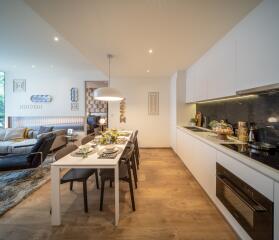 Modern open-plan dining and kitchen area with sleek design