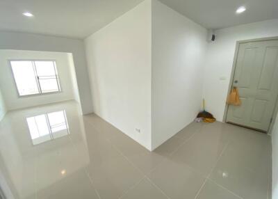 Spacious entryway with ceramic tiled floor and storage closet