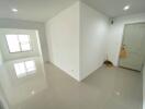 Spacious entryway with ceramic tiled floor and storage closet