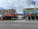 Street view of commercial buildings with multiple storefronts