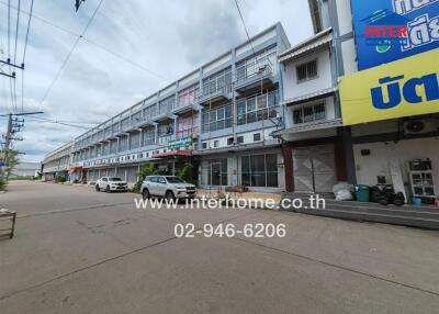 Front view of a commercial and residential building complex