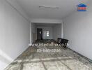 Unfinished room with bare concrete floor and INTER Real Estate logo