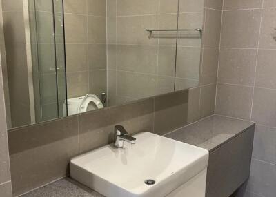 Modern bathroom with large mirror and sink