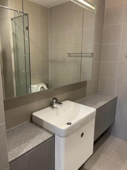 Modern bathroom with large mirror and sink