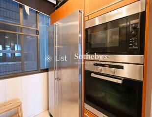 Modern kitchen with stainless steel appliances