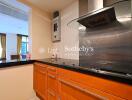 Modern kitchen with sleek stainless steel appliances and wooden cabinets