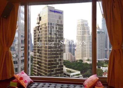 View from window showing cityscape with high-rise buildings