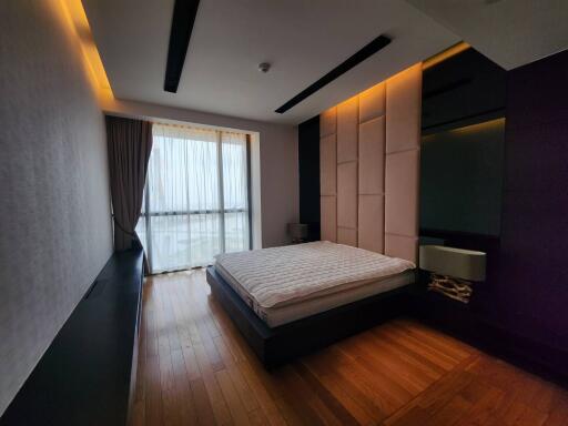 Modern bedroom with large window