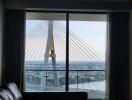 Living room with large window and bridge view