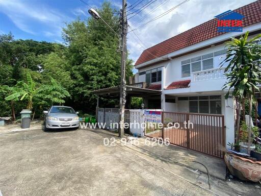 Exterior view of a residential property with driveway and garden