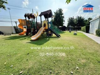 Outdoor play area with playground equipment