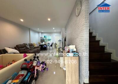 Main living space with toys and stairs