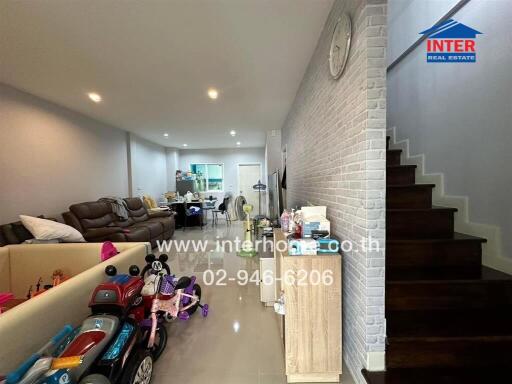 Main living space with toys and stairs