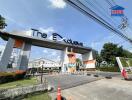 Gated community entrance with 'The Exclusive' sign