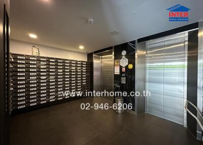 Lobby with mailboxes and elevator