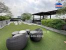 Rooftop garden with seating area and greenery