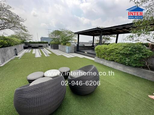 Rooftop garden with seating area and greenery