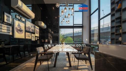 Modern dining area with large windows and stylish lighting