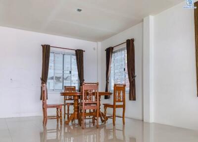 Clean dining area with wooden furniture