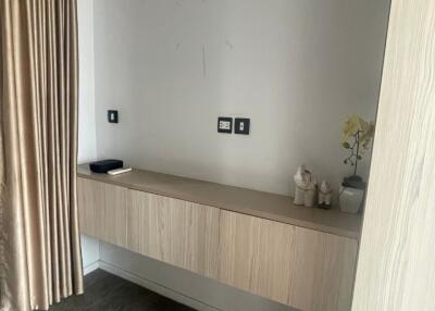 Bedroom interior with floating wooden cabinet and curtain