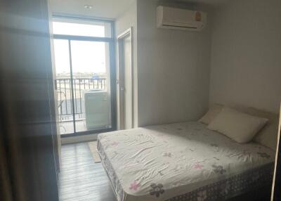 Comfortable bedroom with large window and air conditioning