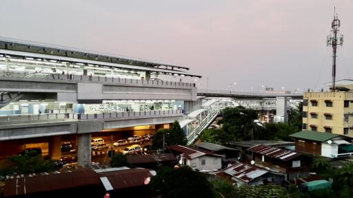 View of a nearby public transportation station and surrounding buildings