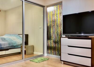 Bedroom with large mirrored sliding door