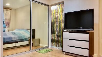 Bedroom with large mirrored sliding door