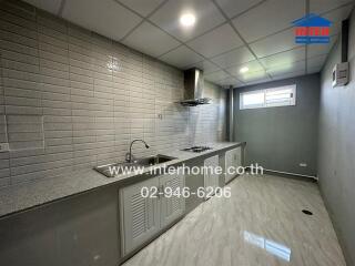 Modern kitchen with tiled walls and countertops