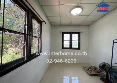 Unfurnished room with large windows and tiled floor