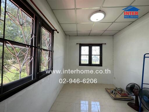 Unfurnished room with large windows and tiled floor