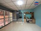 Spacious living room with tiled floor and built-in shelving