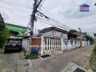 Street view of residential building with attached garage