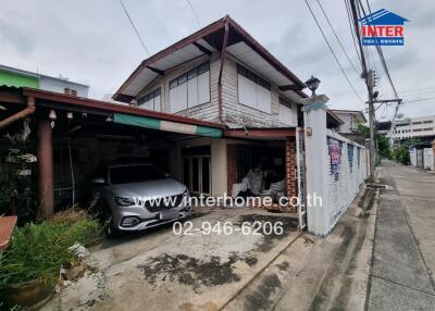 Two-story house with car parked in the garage