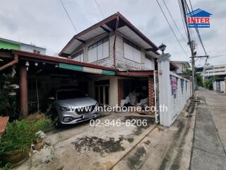 Two-story house with car parked in the garage