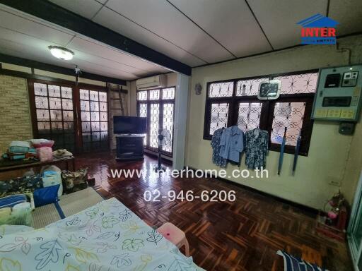 Living room with TV and wooden floor