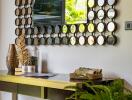 Stylish entryway with decorative mirror, console table, and indoor plants